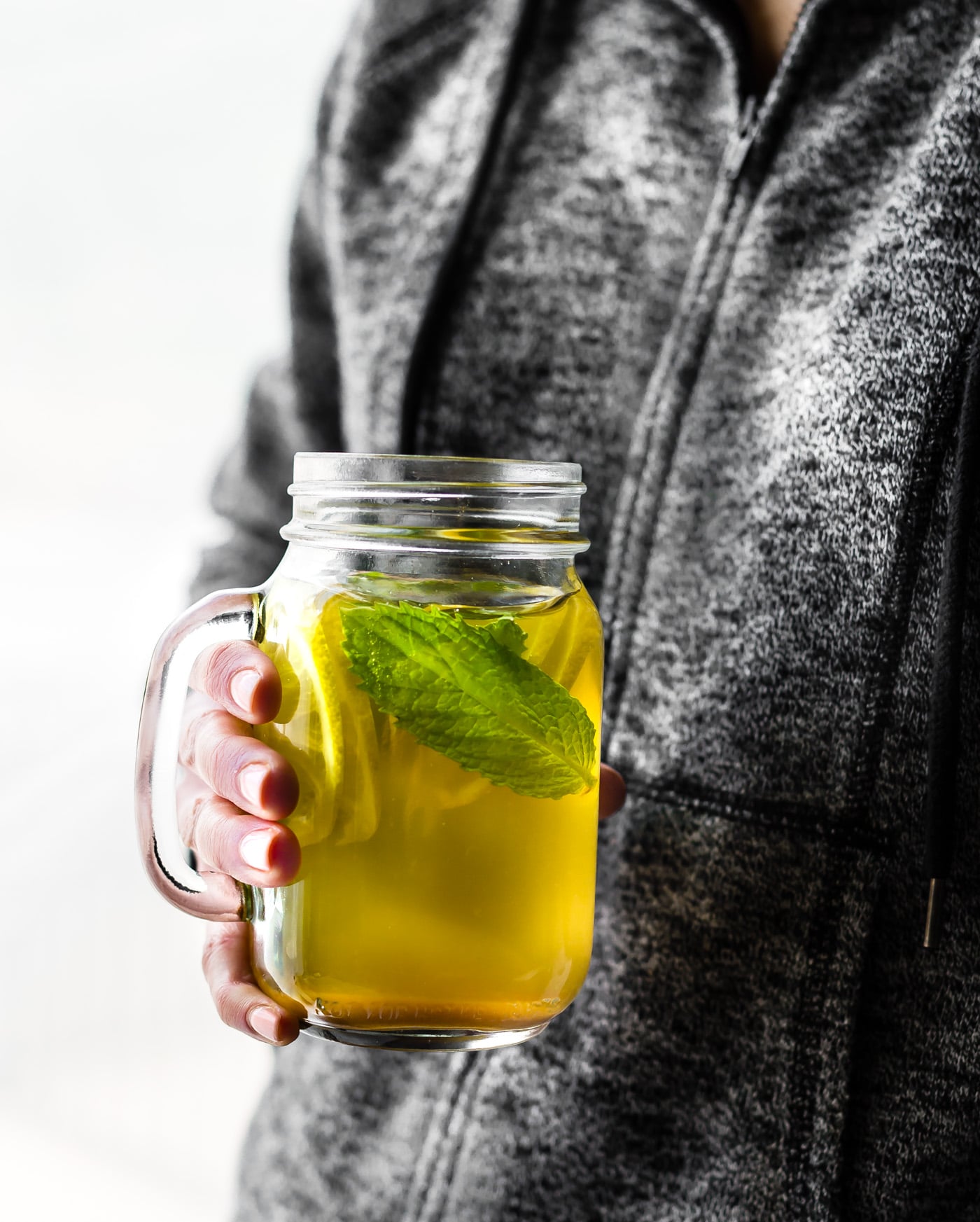 This Turmeric Ginger Lemonade with fresh Mint is great for fighting fatigue and reducing inflammation in the body. It's quick to make, naturally sweetened, and super refreshing! A homemade lemonade with a hint of spice, tartness, and Zing! Vegan, paleo, and AMAZING!
