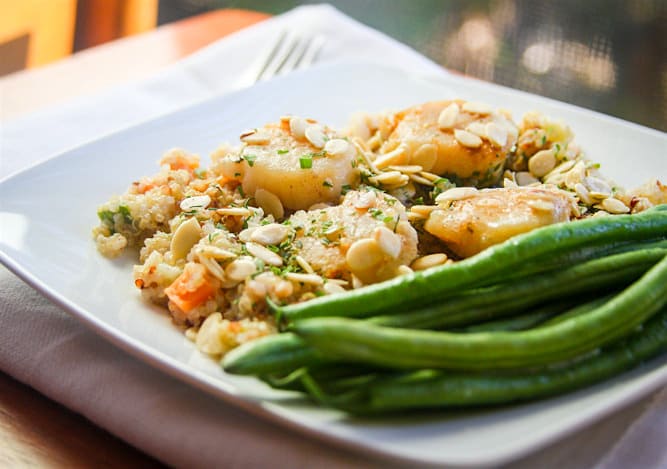 A sweet and savory twist on your regular old stir fry! Yep, coconut butter stir fried quinoa with scallops. Trust me, it's delicious, gluten free, and nutritious!