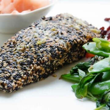 Asian Style Sesame Crusted Salmon with ginger garlic dressing. A refreshing ginger dressing compliments this Asian Style Salmon! Perfect as we transition into spring! Easy to make, full of omegas, and of course, gluten free!. Paleo friendly