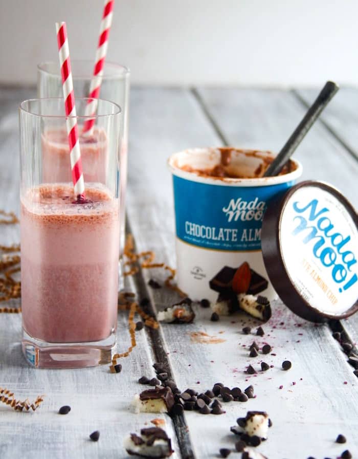 This Almond Joy smoothie recipe is vegan, gluten free, and tastes just like an Almond Joy candy bar, only it's better for you. An ice cream smoothie with vegan chocolate almond ice cream, strawberries, and coconut. The perfect healthy substitute for a milkshake, too!