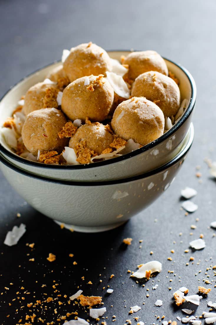 Grain Free Coconut Cream Peanut Butter BGrain Free Coconut Peanut Butter Protein Bites! A rich flavor but packed with protein! These NO BAKE vegan protein bites are lower in sugar and carbs. Great for summer treats!