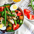 Salade Niçoise is one of the most refreshing salad recipes! This Paleo recipe version is full of flavor, healthy fats, nutrients. Ready in 30 minutes.