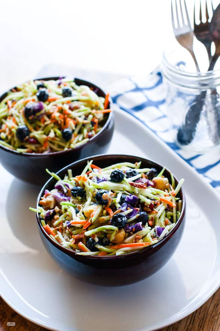 Perfectly Creamy and Tart Broccoli Slaw Salad with Blueberries. It's backed with antioxidants and probiotics! The tang comes from using a kefir and greek yogurt blend instead of mayo. Which also makes it healthy and gut friendly. Super clean eating with great flavor!