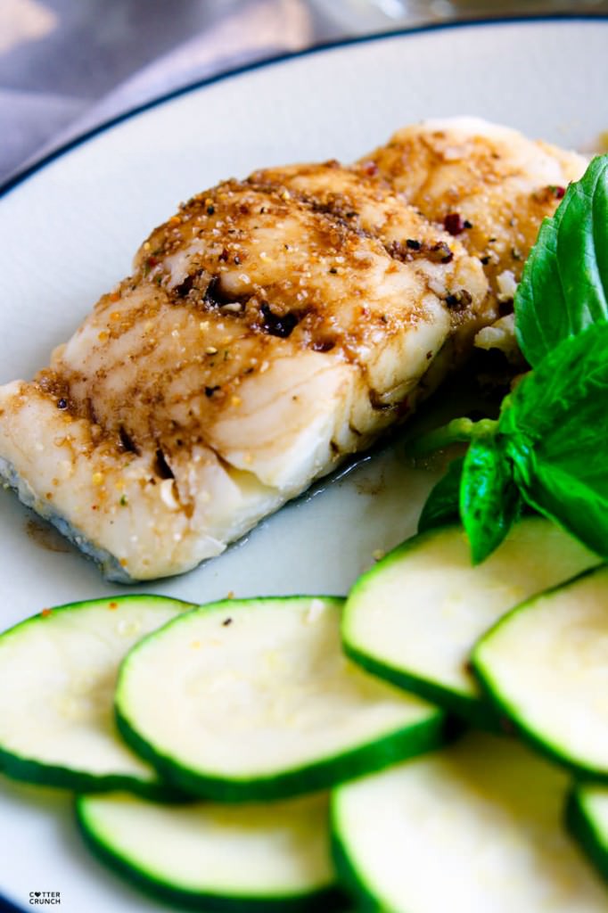 Gluten Free Ginger Lime Tamari baked Cod. It's light, flavorful, healthy, and ready in 15 minutes. A great Spring or Summer meal! Looking for more ways to season fish? Check out my list on cottercrunch.com