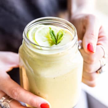 girl holding smoothie with lime and mint
