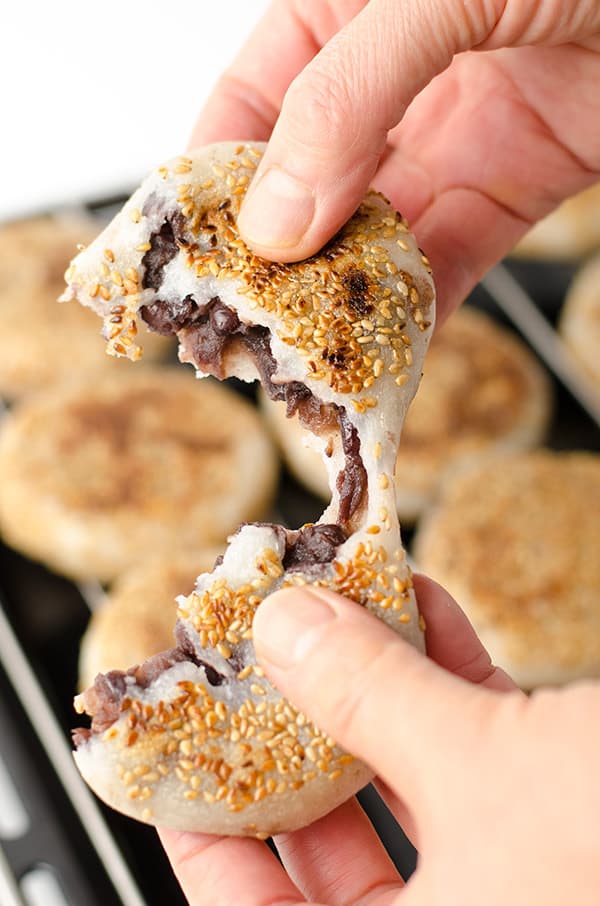 Gluten Free Sticky Rice Cake with Red Bean Paste! Warm and gooey on the inside with crispy crust and toasted sesame on the outside. A healthy twist on a favorite Chinese dessert. @omnivorcookbook