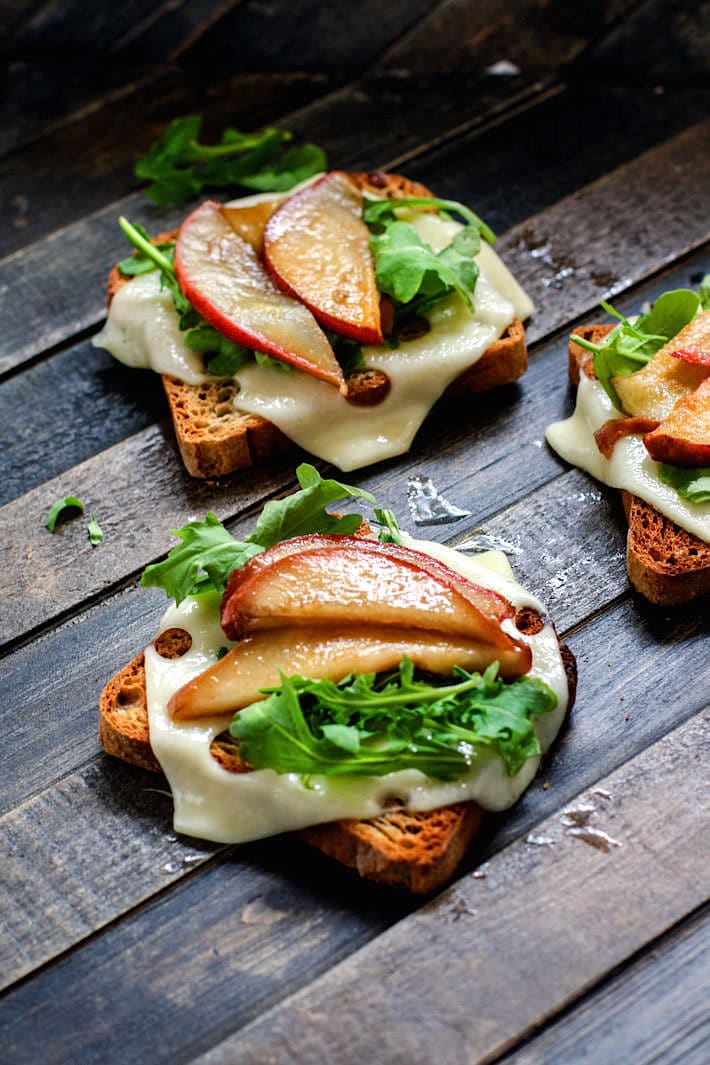 Honey Balsamic-glazed pears with Swiss Cheese and arugula on Gluten Free Rye toast! A delicious vegetarian meal great for a quick lunch, appetizer, or even a post workout recovery meal/snack! Balanced with whole grain gluten free carbs, protein, and healthy fats!
