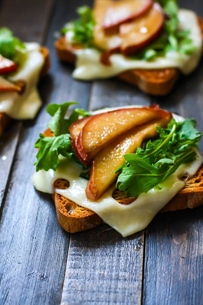 rHoney Balsamic-glazed pears with Swiss Cheese and arugula on Gluten Free Rye Style toast! A delicious vegetarian meal perfect for a quick lunch, appetizer, or post workout recovery meal /snack! Balanced with gluten free whole grain carbs, protein, and healthy fats!