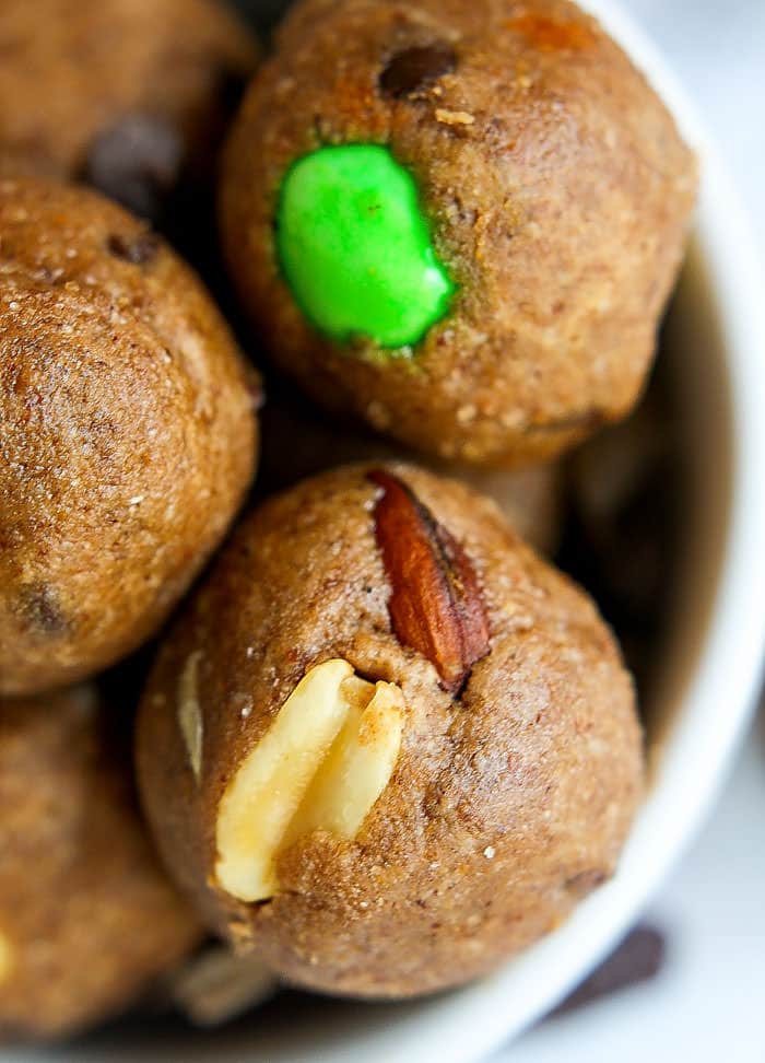 Gluten Free Trail Mix Peanut Butter Protein Bites! These no bake peanut butter bites are super easy to make, packed with protein, healthy fats, and great for snacking at any time! #cottercrunch