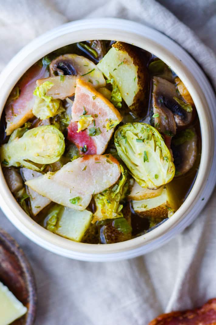 This smoked bacon veggie soup recipe is gluten free, grain free, Paleo friendly, and packed with simple, wholesome ingredients and flavor. Easy to make in a slow cooker or the oven! Get the recipe at CotterCrunch.com