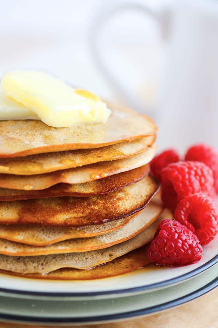 Gluten Free Swedish Style pancakes, made in the oven! All you have to do is blend ingredients, pour, bake, flip, and bake again! I made these gluten free Swedish pancakes a little healthier with less sugar and yogurt vs butter. This recipe allows you to make more panackes at once with little mess.
