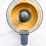 Overhead view homemade cashew butter in a food processor