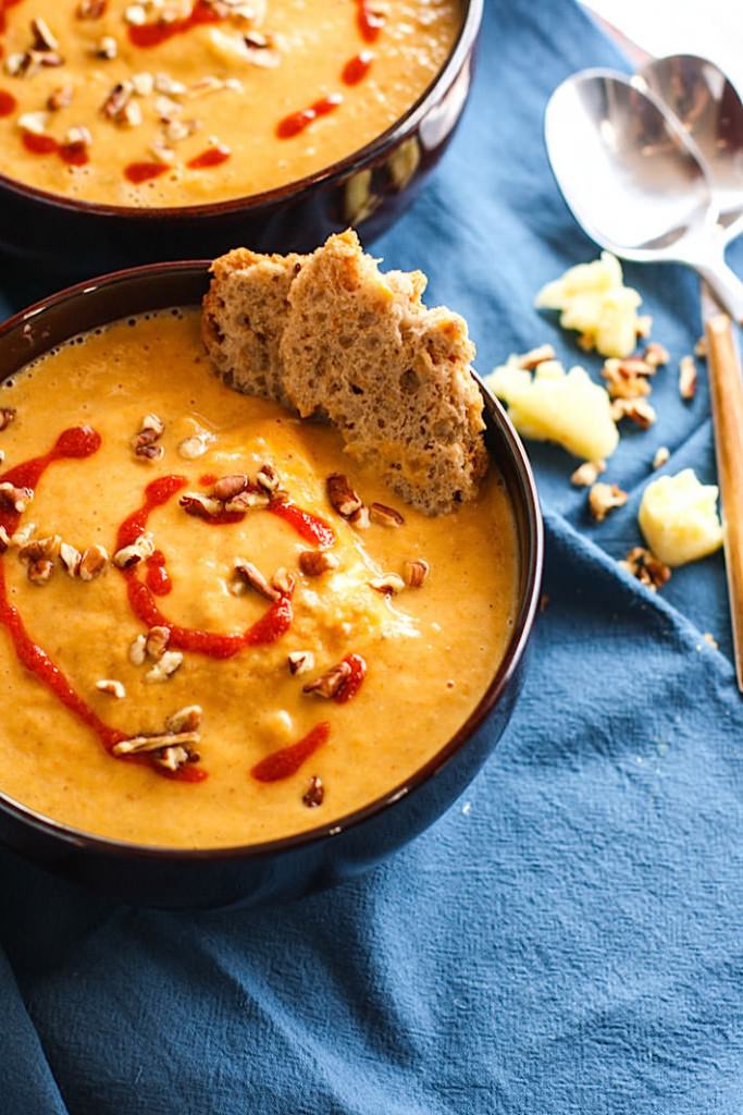 Vegan Persimmon and Butternut Squash Soup! A creamy, sweet yet smokey butternut squash soup recipe with the addition of Persimmon and it's amazing health perks! Paleo, Gluten free, dairy free, and super easy to make! This is one immunity boosting delicious soup!