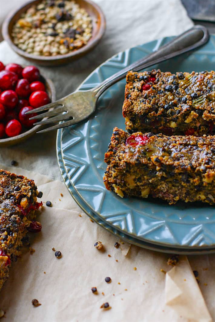 Gluten free Vegan Cranberry Maple Lentil loaf! A great dish to add to your Thanksgiving or Christmas table. Lentils, fresh cranberries, nuts, and sautéed veggies all baked up into one healthy and delicious lentil loaf. The Maple glaze topping makes it even more flavorful. Super easy to make as a side dish or a main dish.