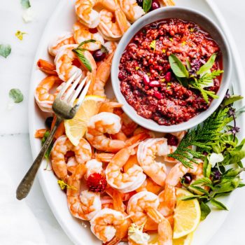 Shrimp cocktail can be made with so much more than plain cocktail sauce! This cranberry basil shrimp cocktail is made with the BEST homemade cocktail sauce! It's a refreshing and healthy appetizer that's gluten free, paleo, low carb and easy to make. #seafood #paleo #appetizer #lowcarb