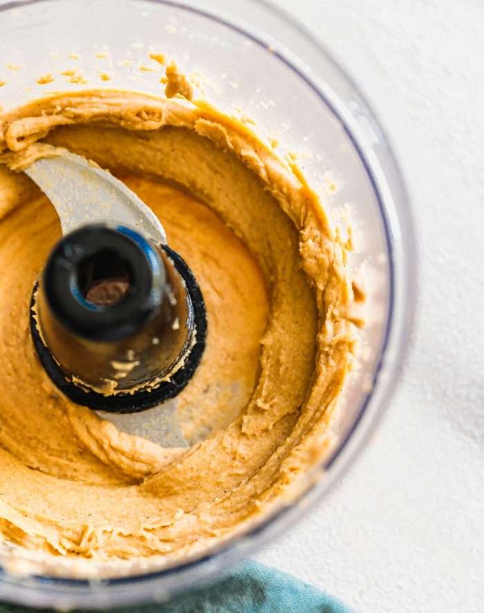 Vegan maple cashew cream cheese frosting in a food processor