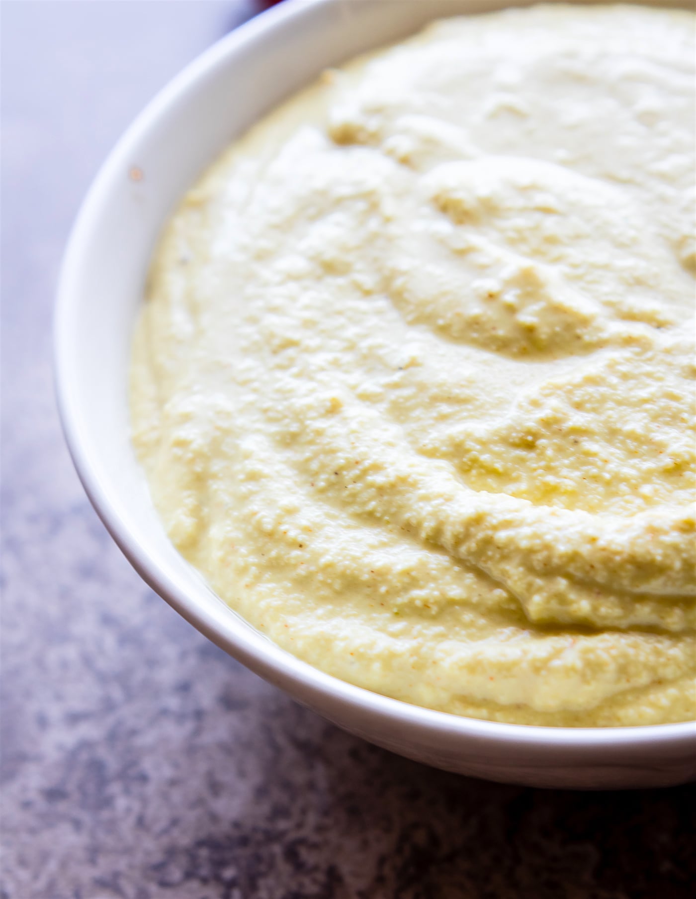 Side view cashew cream sauce in bowl