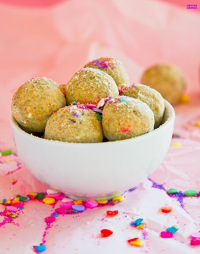 Easy, no-bake, protein-rich, gluten free protein bites that are bursting with flavor. These Lemon Vanilla Sprinkle bites are such a treat for Spring! Packed with healthy fats and protein, these are perfect for after workout or school snacks! You could use peanut butter, almond butter, or even sunflower butter.