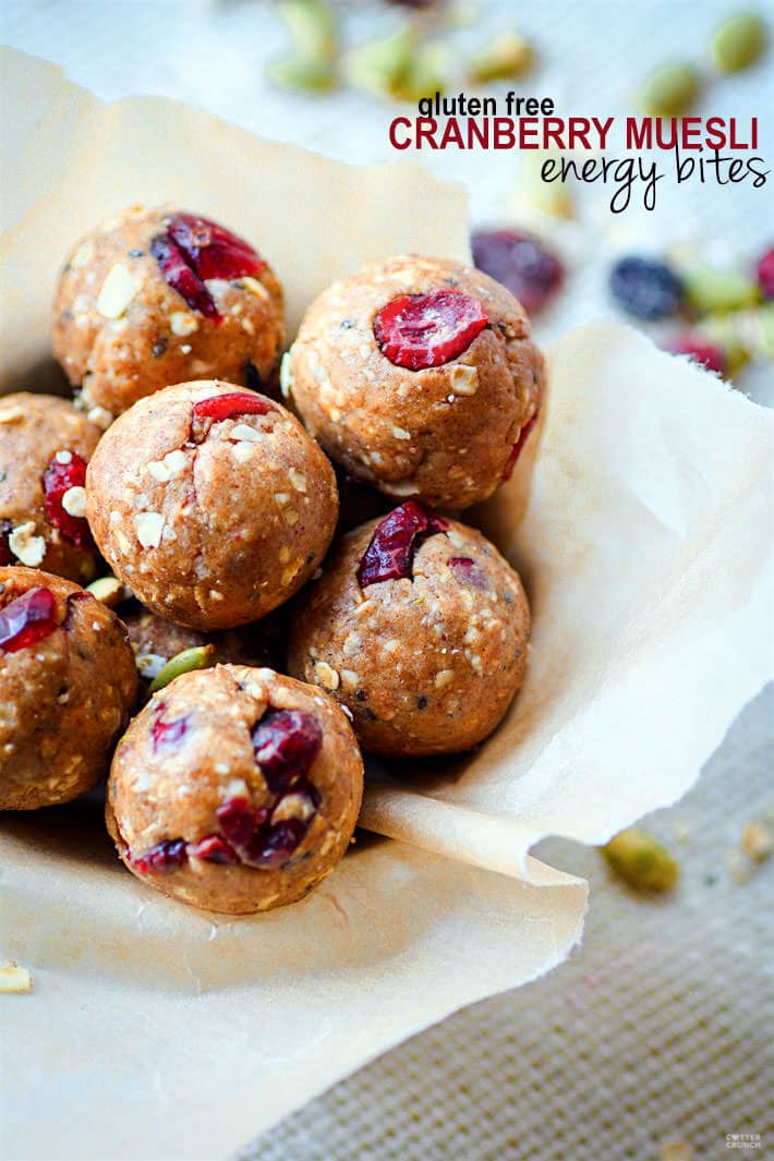 Close up view of no-bake Muesli Energy Bites rolled to bite-size with dried cranberries poking from the bites