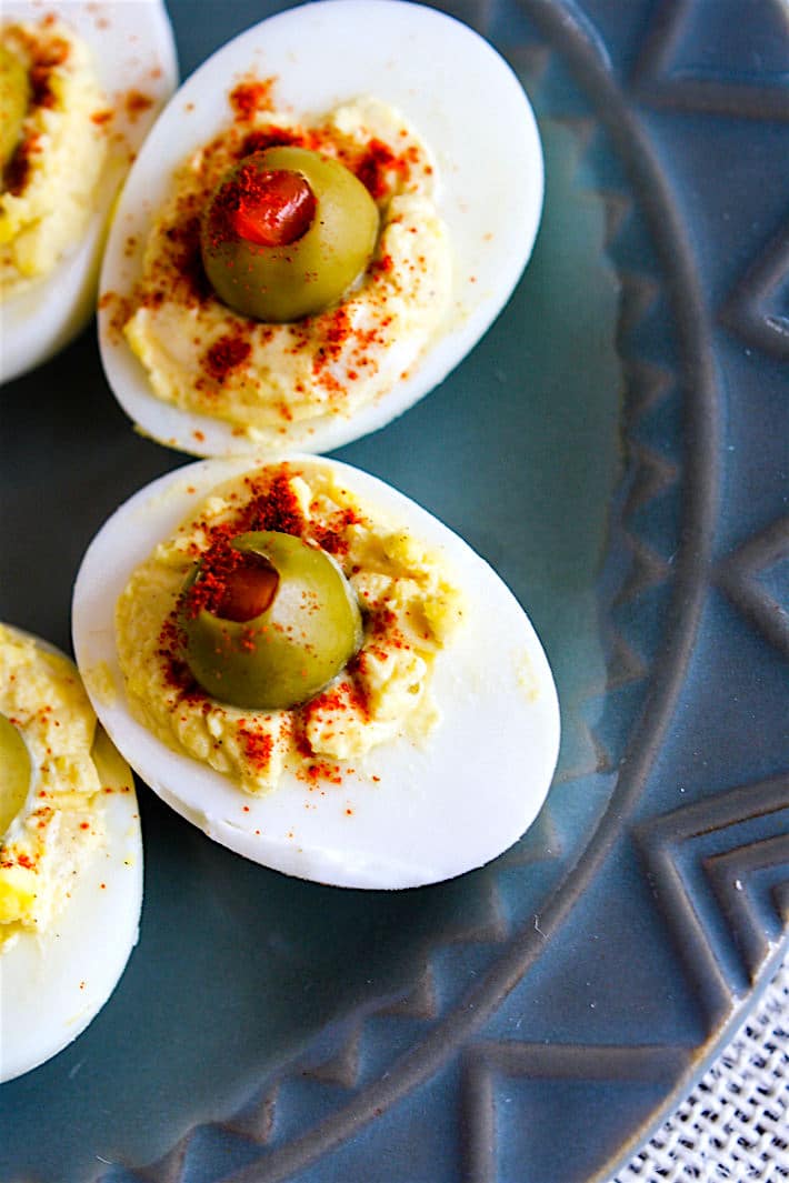 Creamy Olive Deviled Eggs- low carb, healthy, and packed with Vitamin D, E, and Calcium! Great appetizer or potluck recipe!