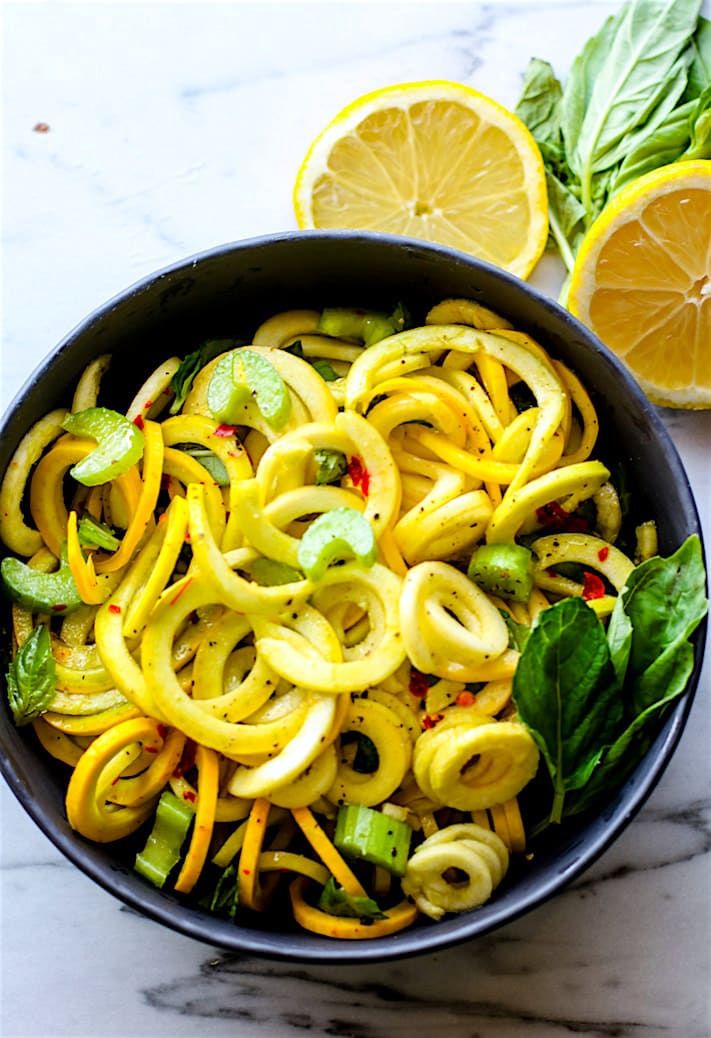 Simple, healthy, nourishing! Paleo and Vegan Basil Mint Yellow Squash Spiralized Salad. REAL FOOD ingredients combined to make one beautiful spiralized salad! A naturally gluten free veggie salad bursting with flavor, nutrients, and color
