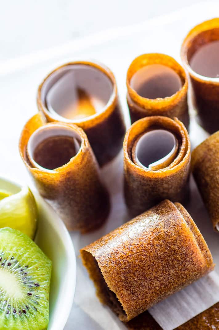 Super Simple and Healthy Citrus Kiwi Pineapple Homemade Fruit Roll Ups! These homemade fruit roll ups are an awesome snack for kids, adults, and active folk who need real food fuel! Homemade fruit rolls ups you can make in the dehydrator or oven. Real fruit based and no additives! 