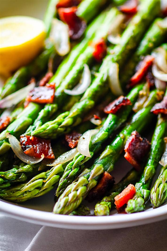 Easy Peppered Candied Bacon and Asparagus It's paleo, gluten free, and super simple to make! Bacon and Asparagus; a side dish match made in heaven.