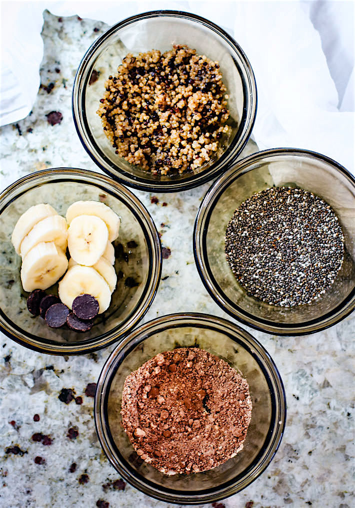 ingredients in small bowls to make a chocolate banana quinoa microwave mug cake