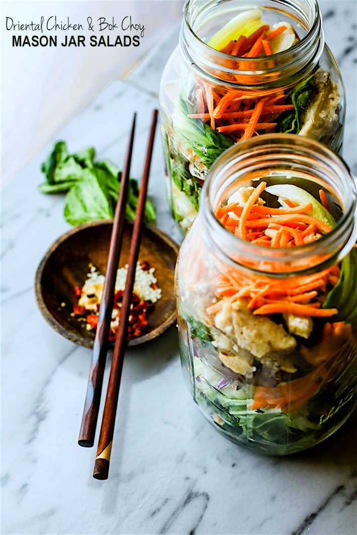 Easy Oriental Chicken Bok Choy Mason Jar Salads! Light, Gluten Free, and Paleo friendly oriental style mason jar salads that are great for lunch or dinners on the go! Perfect use of leftover vegetables and grilled or stir fried chicken as well. Portable Healthy lunches just got easy.