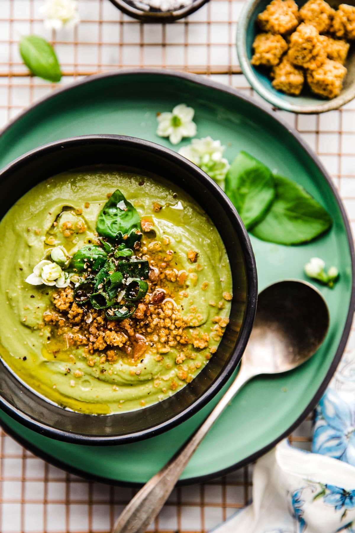 artichoke pea soup in bowl with spoon