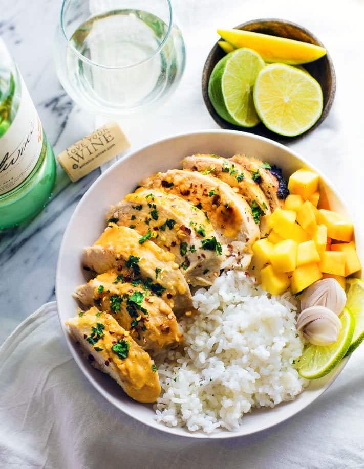 Time to find the perfect marinated chicken recipe you over and over again! Like this Gluten Free Chili-Lime Mango Marinated Chicken Bowl recipe. This Marinated Chicken recipe is super easy to make, healthy, dairy free, and delicious! A great way to learn how to cook with wine and use it in a light marinade.