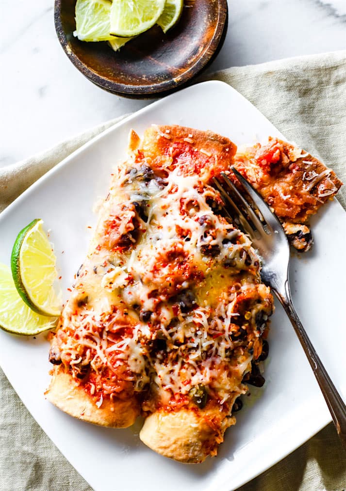 Healthy Gluten Free Tex Mex Salmon Black Bean Burrito Bake. A family favorite that even non fish eaters love! Simple, light, rich in Omega 3's, kid friendly, and feeds a crowd. @cottercrunch
