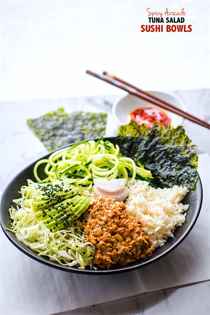 Super Simple Spicy avocado tuna salad sushi bowls. A naturally gluten free and low mercury tuna salad mixed with fun sushi ingredients, then tossed all in a bowl. This is a tuna salad for sushi lovers or anyone looking for a great healthy lunch! Full of omegas, protein, and more.
