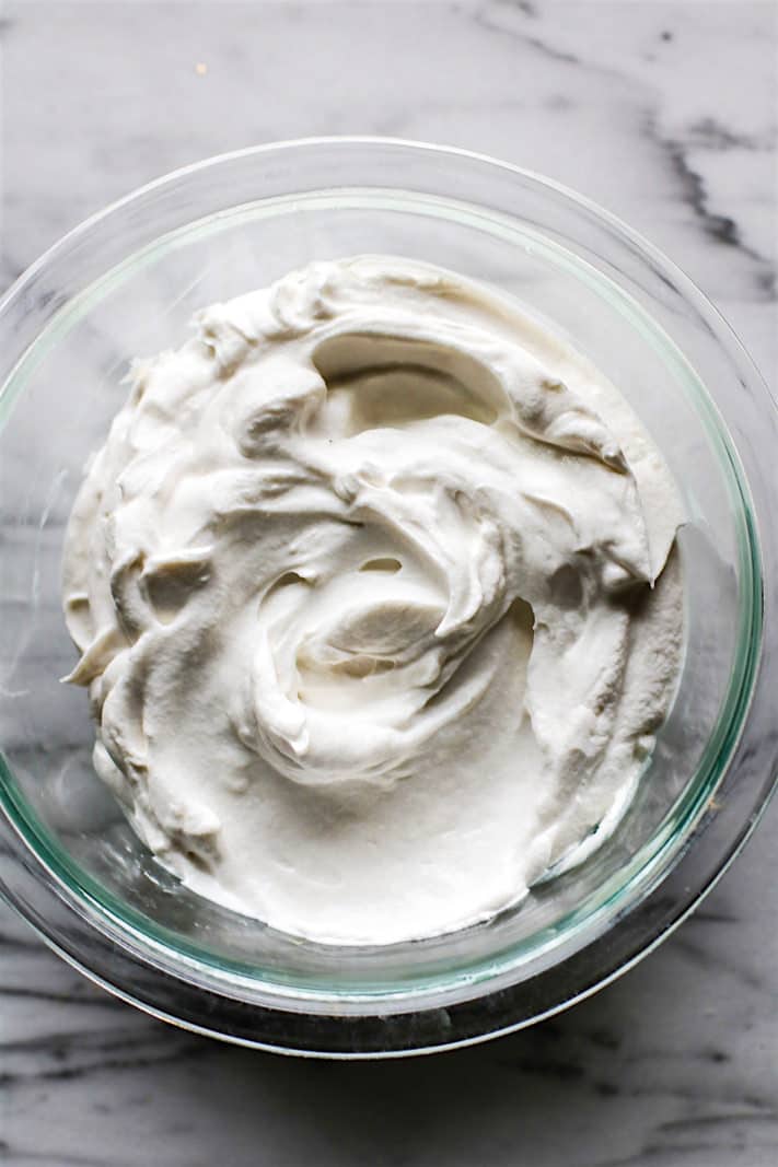 Vegan frosting has never been so easy to make! Making fluffy, gluten-free coconut cream vegan frosting takes 2 ingredients and just one method. Paleo friendly recipe! | CotterCrunch.com