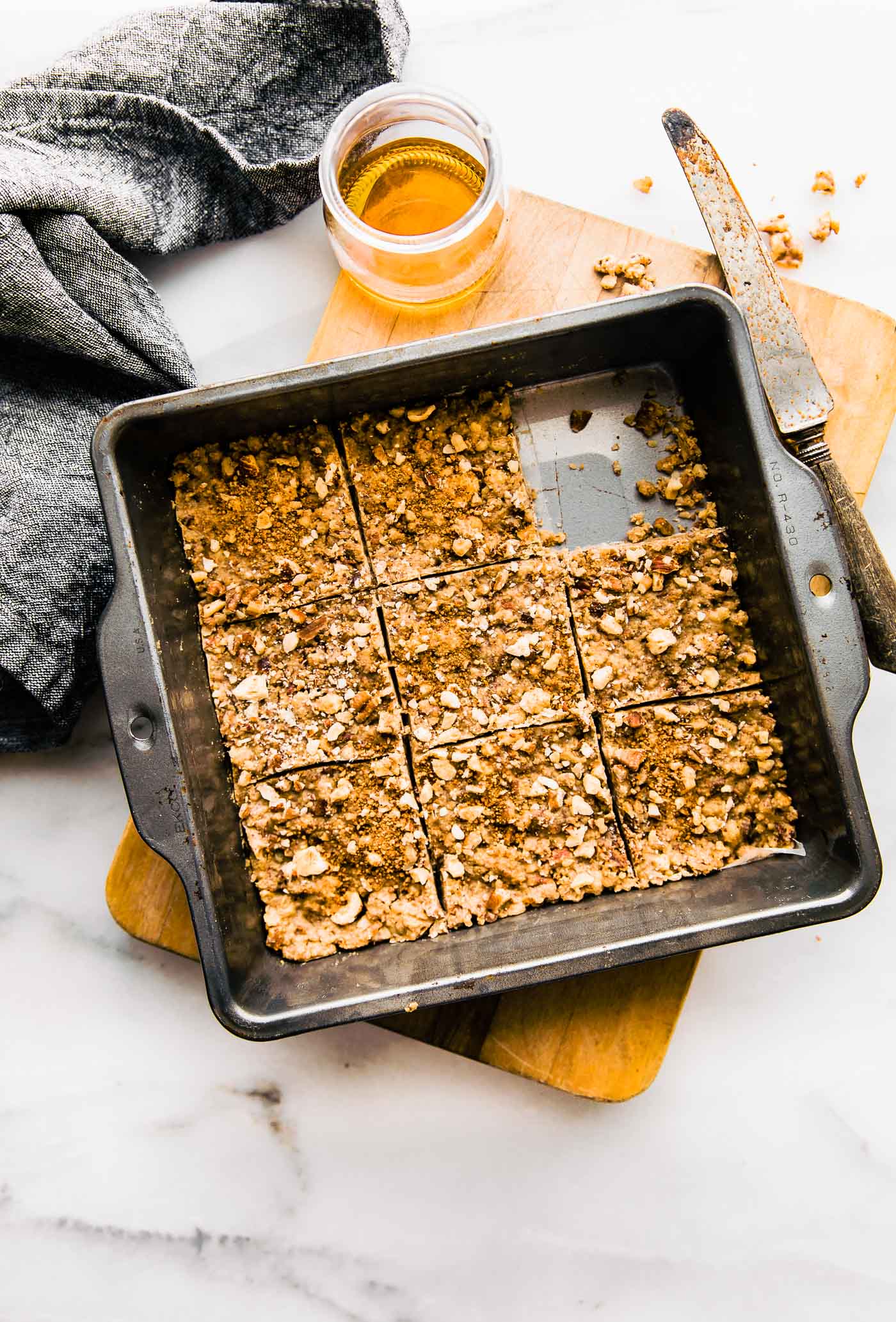 Overhead view baking pan filled with Paleo Baklava bars cut into squares