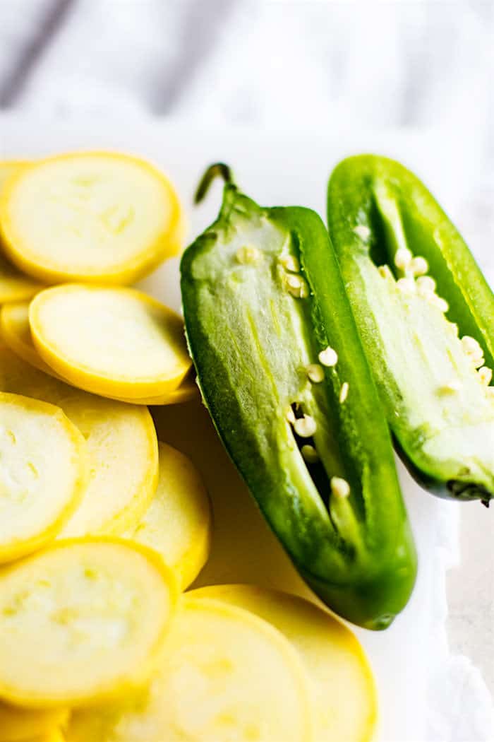 sliced yellow squash and jalapeno peppers