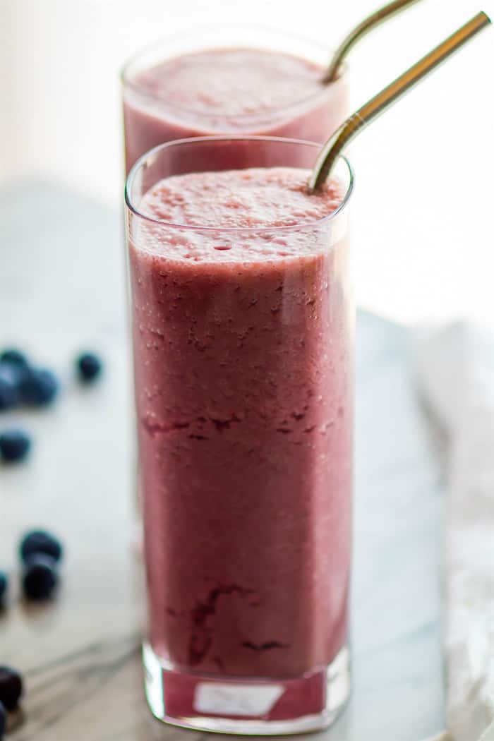 No need for ice in this 5 ingredient Sparkling Frozen Fruit Smoothie! This Fizzy Frozen Fruit smoothie is the perfect summer refresher. Super healthy, easy to make, and naturally sweetened. Paleo and Vegan friendly. Just think of it as an Italian ice, slushy, and a smoothie all in one!