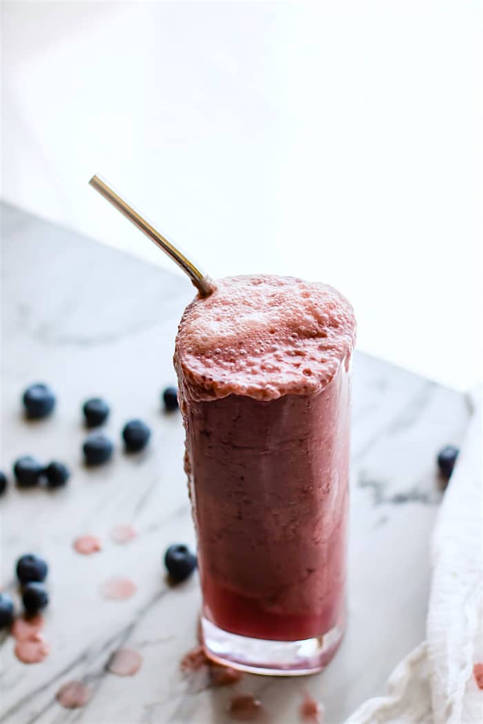 o need for ice in this 5 ingredient Sparkling Frozen Fruit Smoothie Recipe! This Fizzy Frozen Fruit smoothie is the perfect summer refresher. Super healthy, easy to make, and naturally sweetened. Paleo and Vegan friendly. Just think of it as an Italian ice, slushy, and a smoothie all in one!