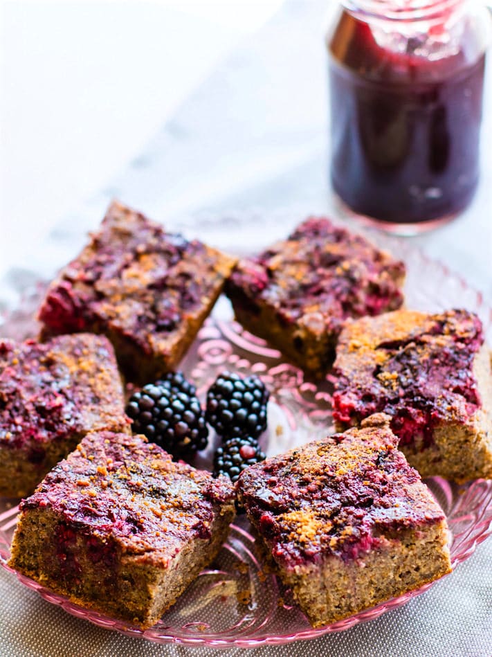 platter of quinoa cakes topped with sweet blackberry jam