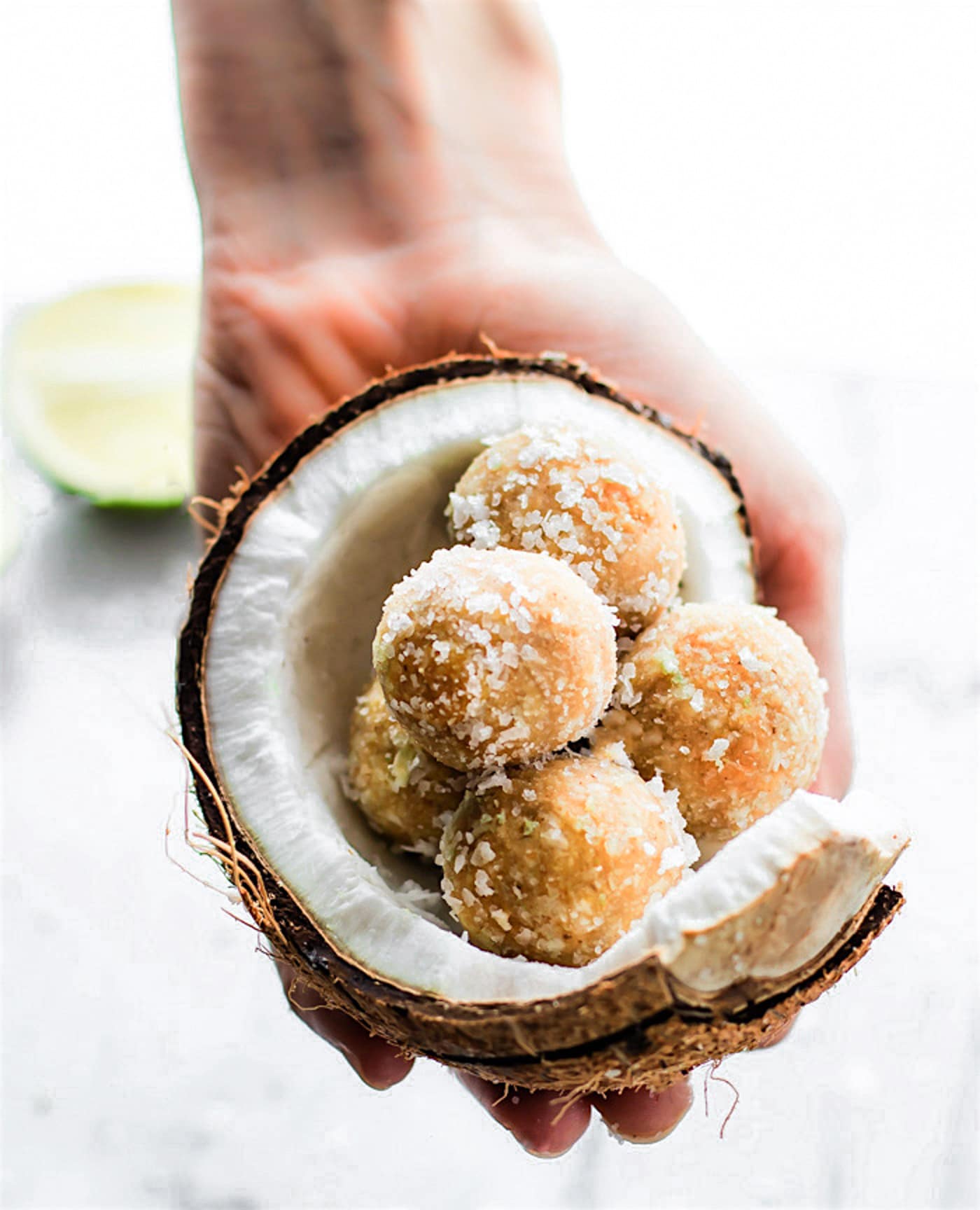 No Bake Coconut Margarita Bites! Super simple no bake coconut margarita treats in dessert bite form! These bites are naturally gluten free, paleo friendly, and vegan! Bites that actually taste like a frozen margarita with natural lime and coconut flavors.