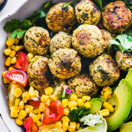 falafel balls in a pan with corn, avocado, and tomato! Lime to top.