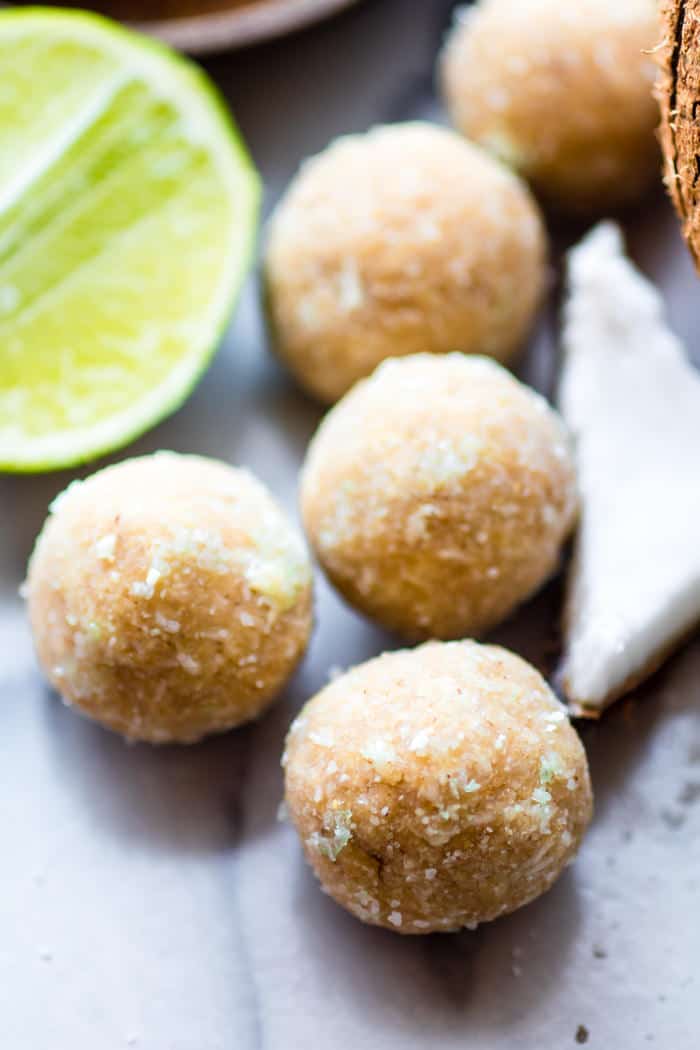 No Bake Coconut Margarita Bites! Happy Hour in Bite form! These bites are naturally gluten free, paleo friendly, and vegan! Bites that actually taste like a frozen margarita with natural lime and coconut flavors. Can we say CHEERS?!