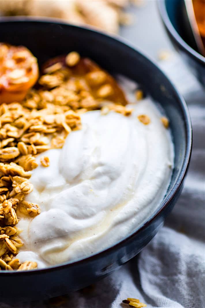 Gluten Free Char-grilled apricot parfait dessert bowls! These dessert bowls are great for dessert or breakfast. A light and simple dessert that's layered across with glazed grilled apricots, whipped coconut cream, and wholesome granola. (dairy free, vegan friendly)