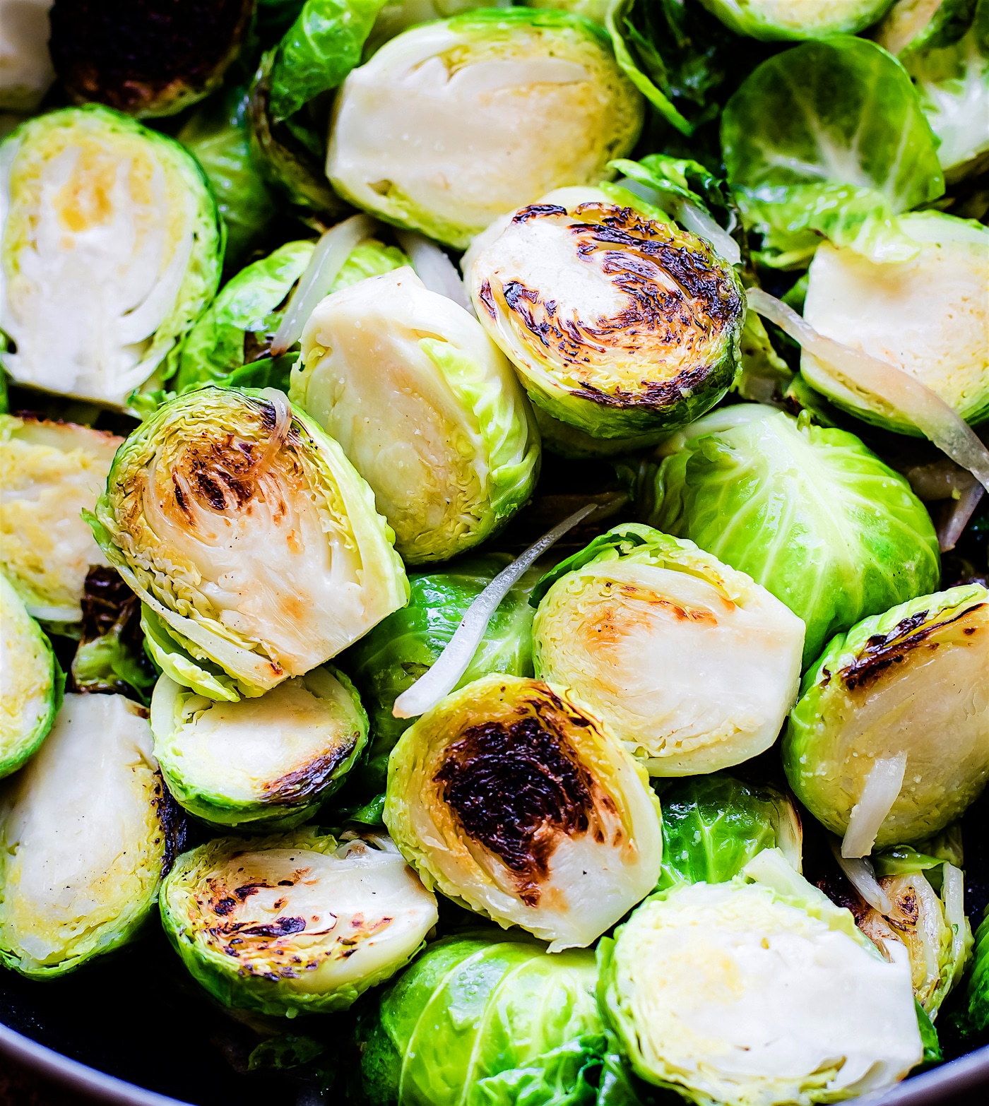 Close up view Brussels sprout halves lightly sauteed.