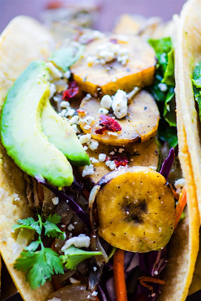 Healthy and Easy Crock Pot Cuban Pork Tacos recipe with fried plantains! These delicious crock pot pork tacos are light, citrusy, and naturally gluten free.