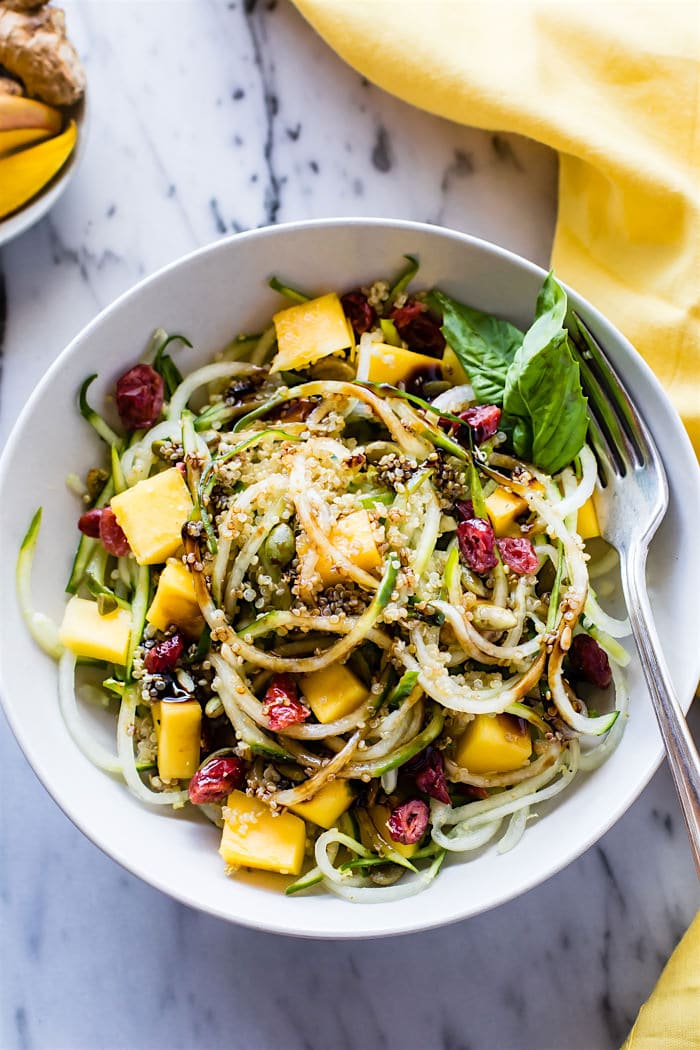 Zesty Mango Spiralized Cucumber Salad. Grab your spiralizer and make this light to Vegan Spiralized Cucumber Salad in less that 10 minutes! Sweet Mango, Ginger, Cucumber, Quinoa, and more. Healthy, easy, gluten free. Plus 4 other Spiralizer Salad favorites to try!