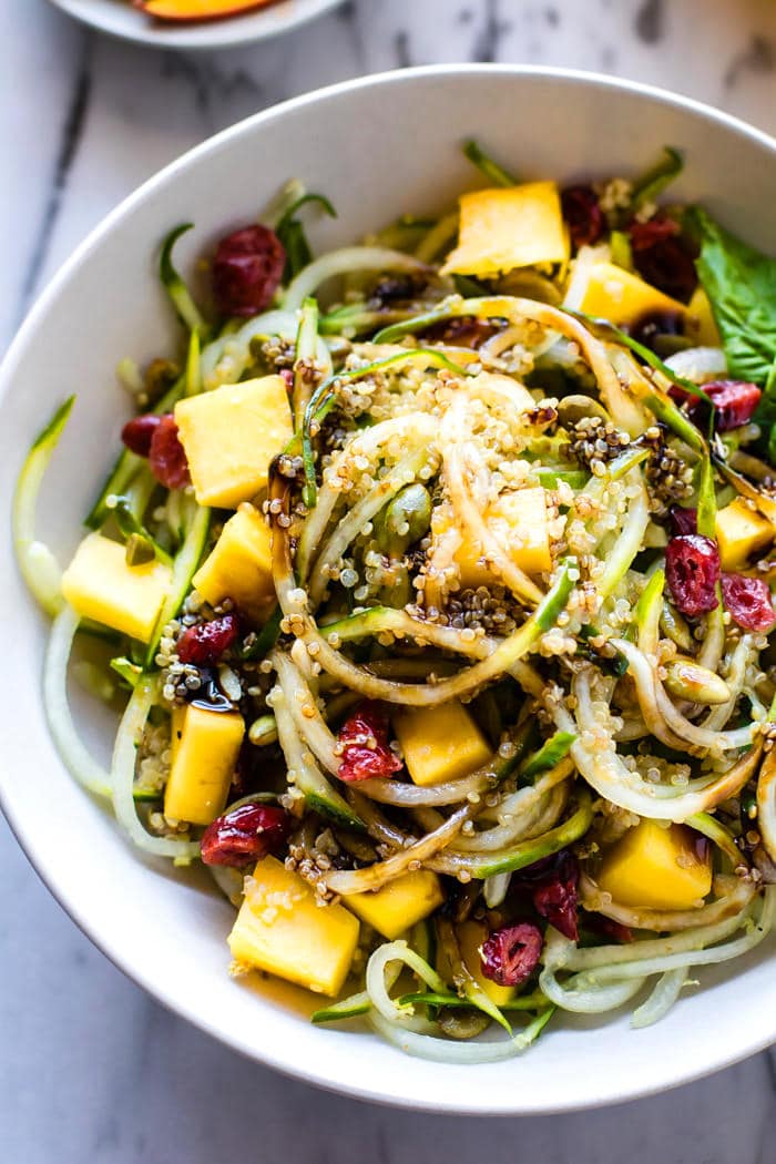 Zesty Mango Spiralized Cucumber Salad. Grab your spiralizer and make this light to Vegan Spiralized Cucumber Salad in less that 10 minutes! Sweet Mango, Ginger, Cucumber, Quinoa, and more. Healthy, easy, gluten free. Plus 4 other Spiralizer Salad favorites to try!