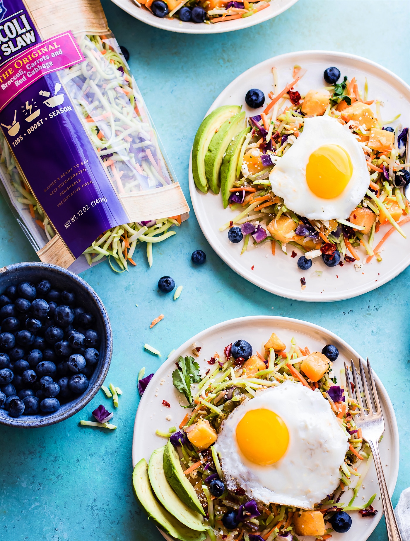 Breakfast salads are the best way to start the day! Create a healthy warm Paleo morning meal with lightly cooked broccoli cole slaw, onion, and squash topped with seasonal fruit and a protein rich fried egg! A nourishing breakfast salad worth waking up for! Easy, delicious, nutritious!