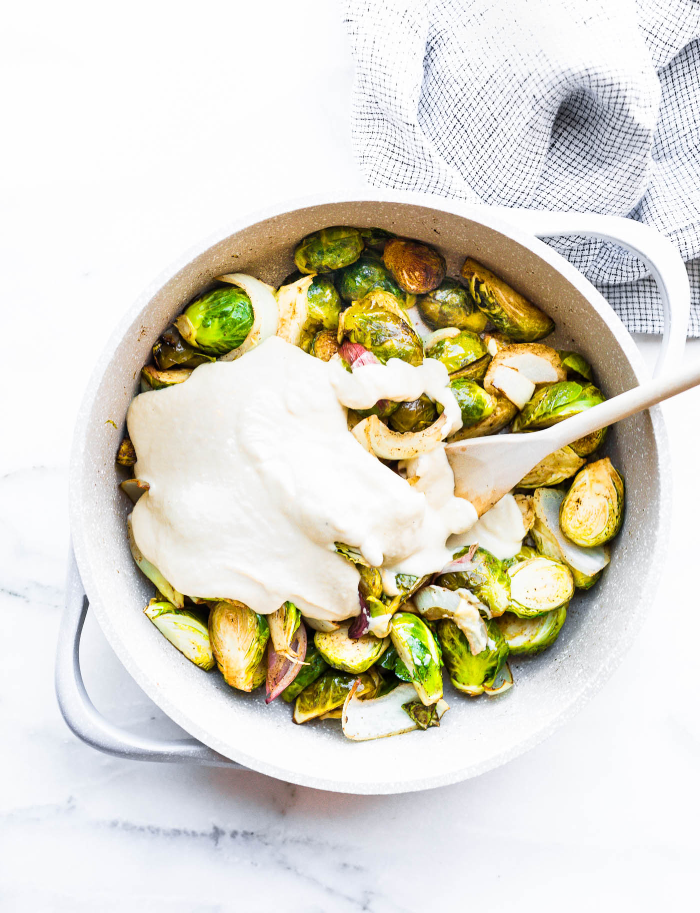 Creamy Mustard sauteed Brussel Sprouts Salad! A Brussel Sprouts salad tossed in a vegan creamy mustard cashew sauce. It's an easy to make holiday side dish! #paleo #vegan #salad #holidays