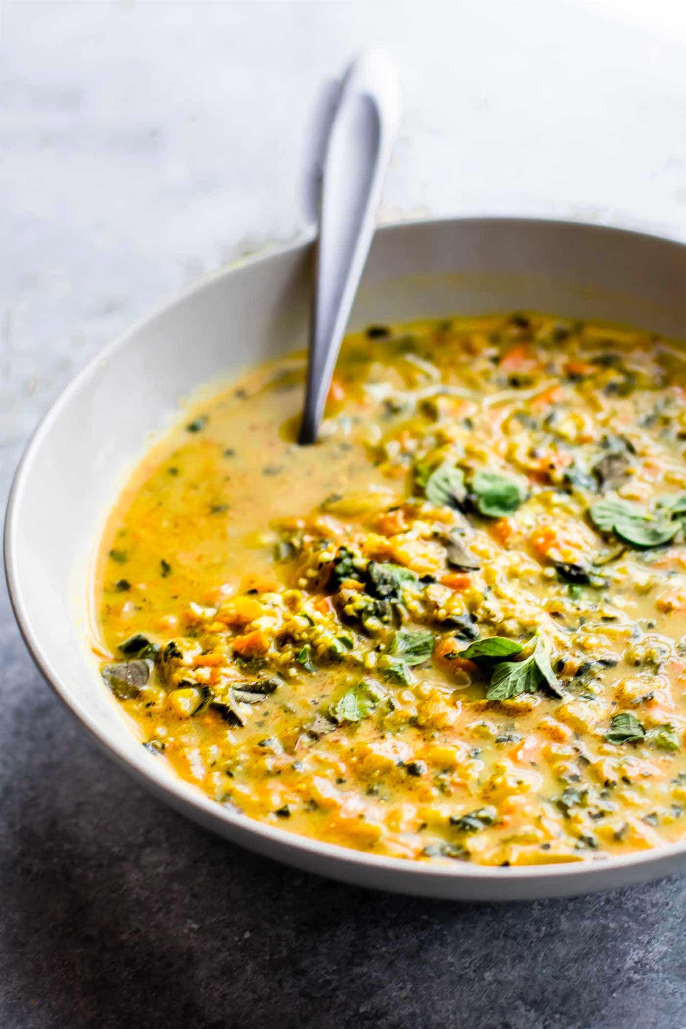 bowl of vegan kale soup with cauliflower rice